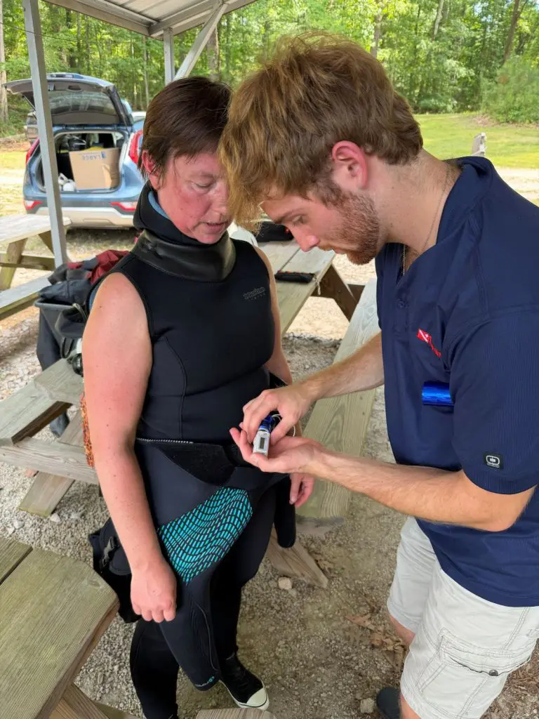 Trystan prepares a Holter Monitor for a dive with his Principal Investigator Dr. Frauke Tillmans